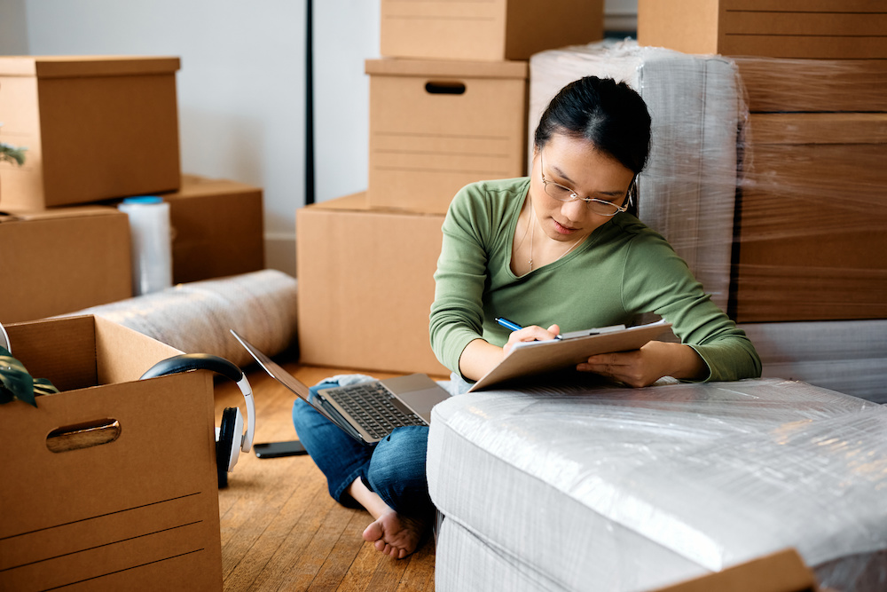 Woman with moving in checklist